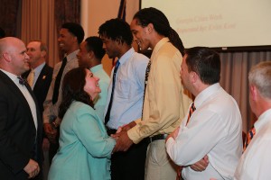 students shaking hands with GHC employees
