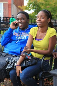 smiling students on a bench