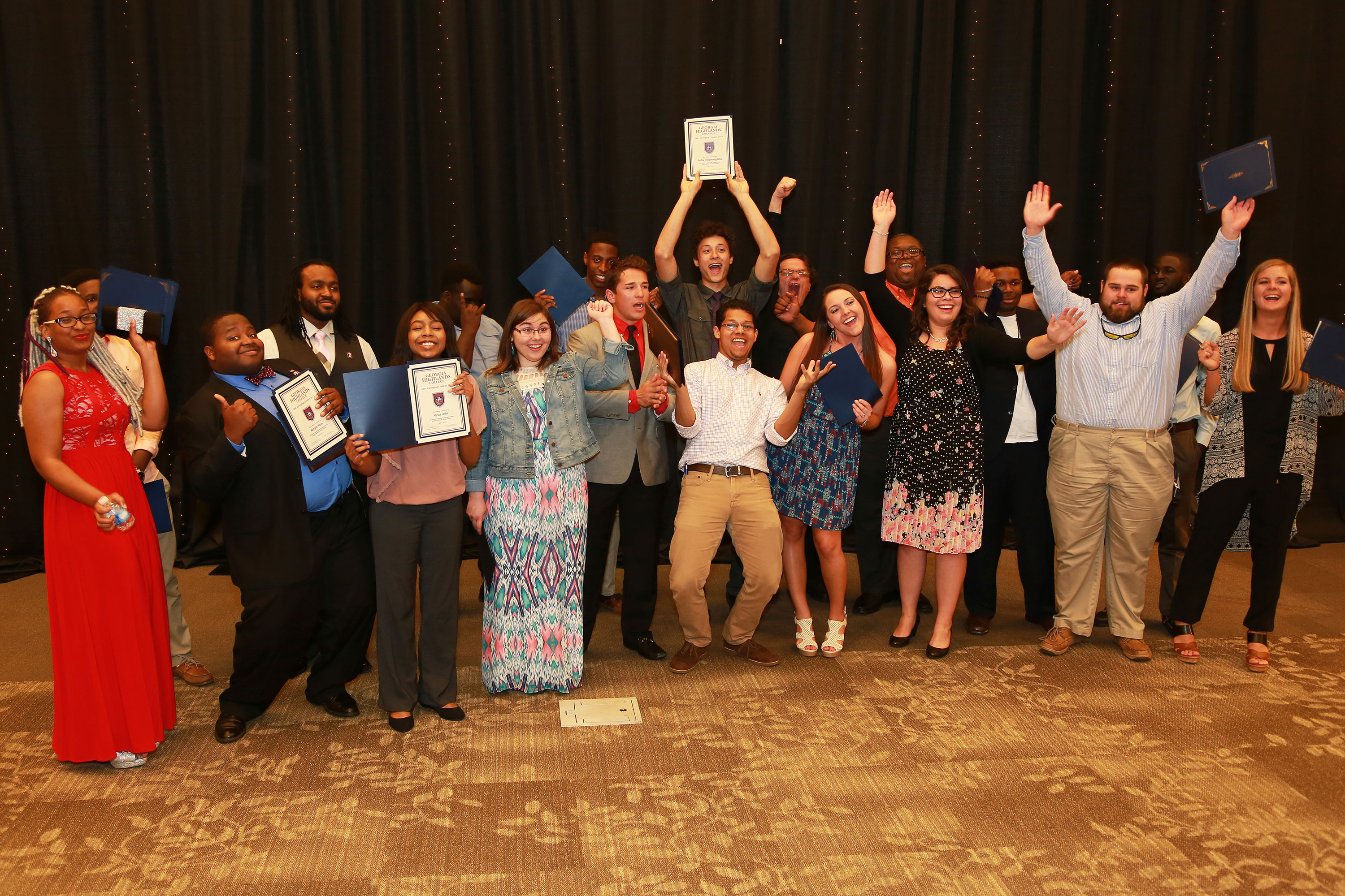 students cheer with awards