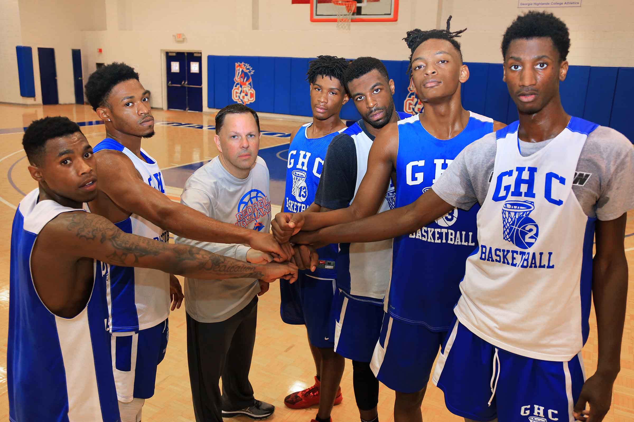 baskebtall team with hands together