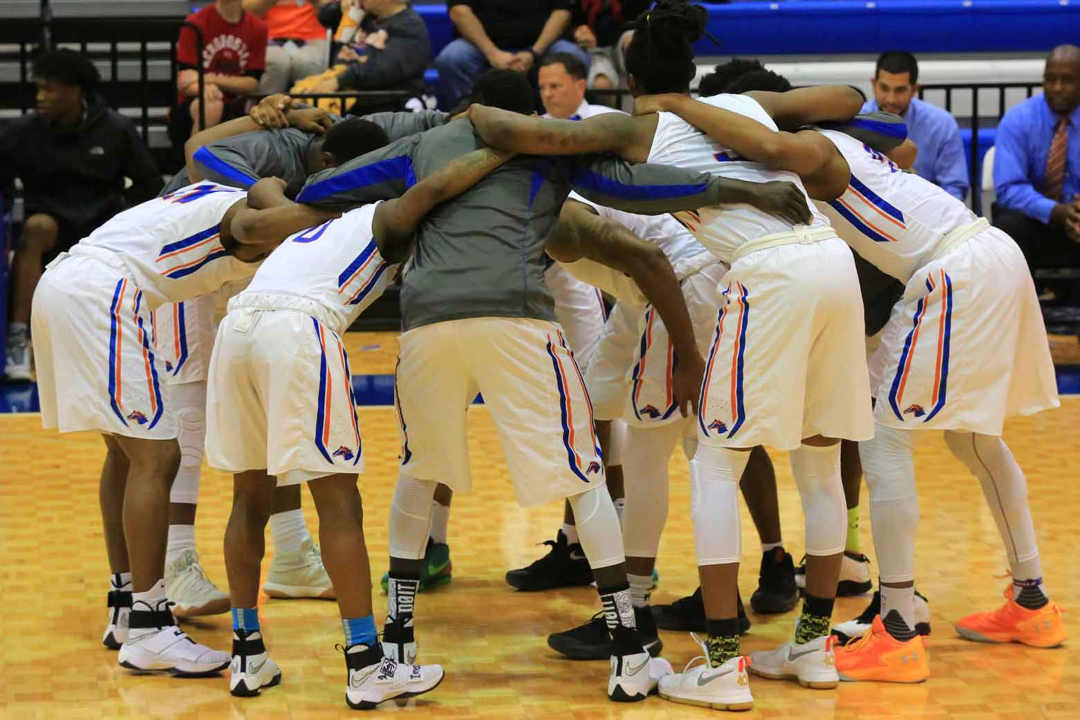 players in huddle