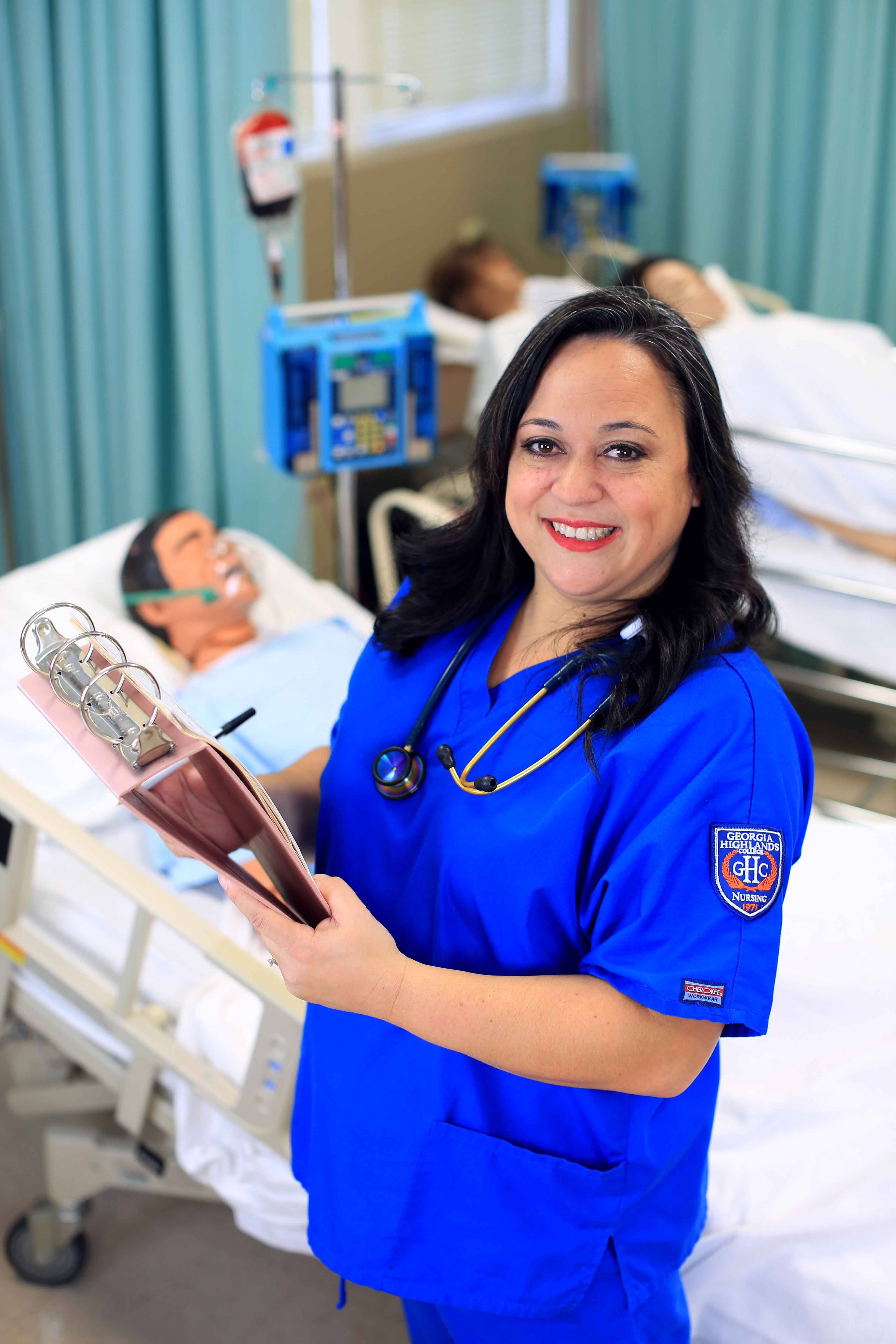 nursing student with clipboard