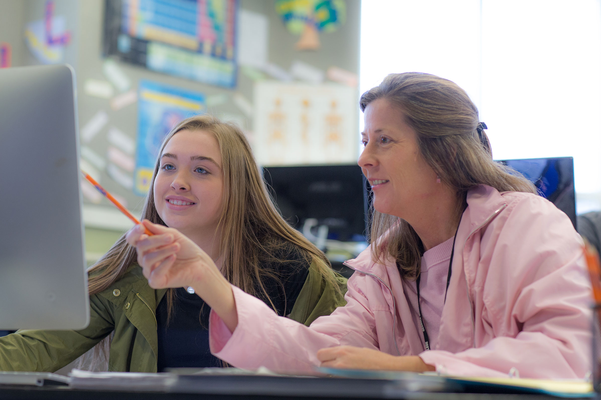 teacher working with student