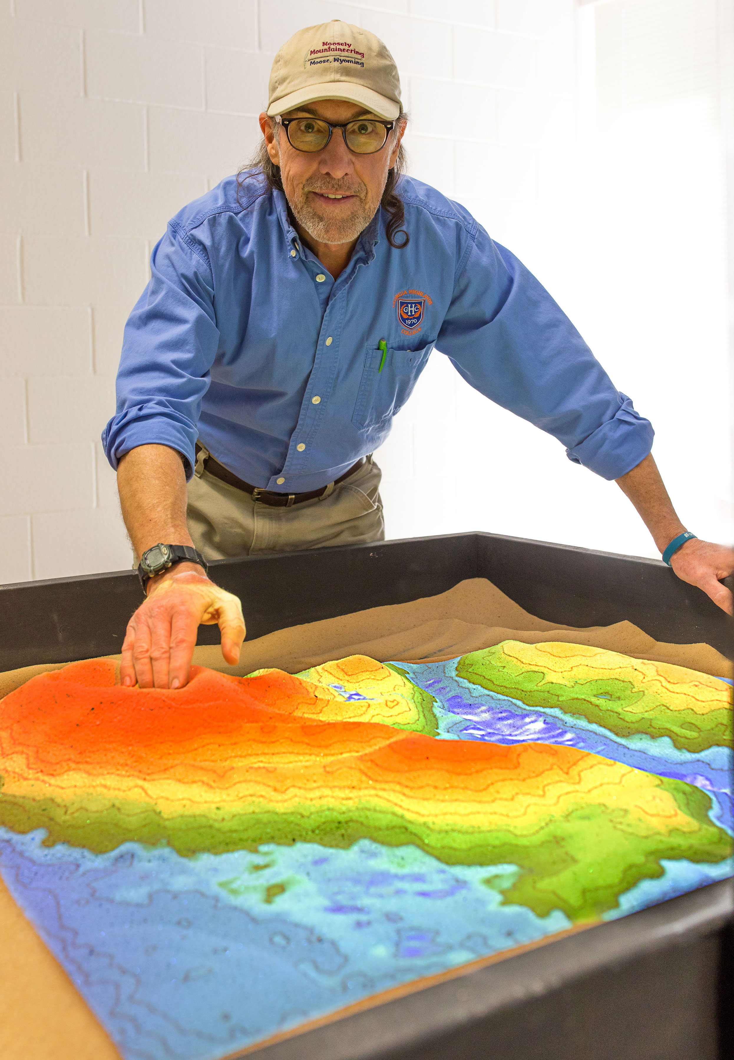 professor demonstrates sandbox