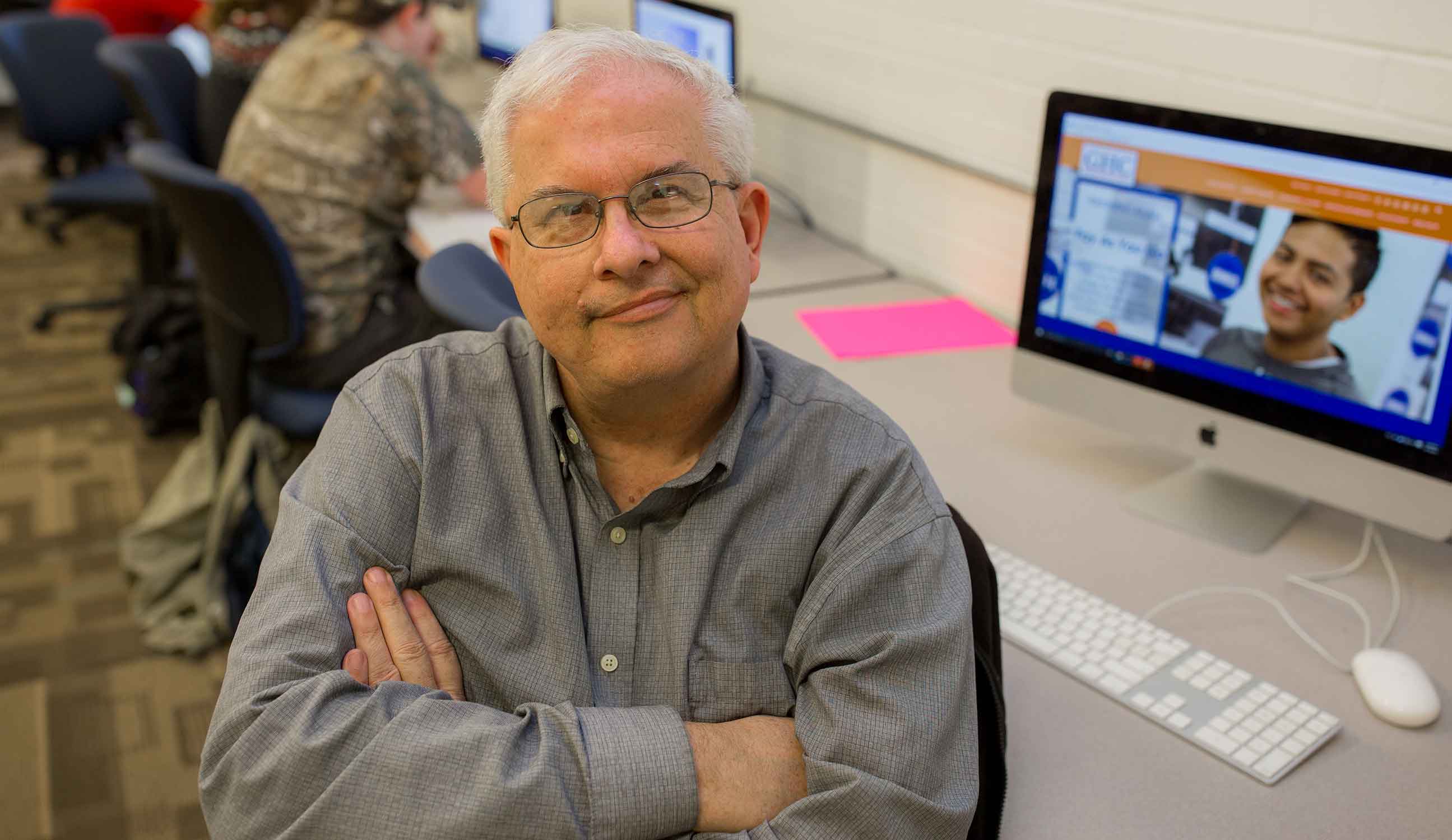 man sitting in front of computer