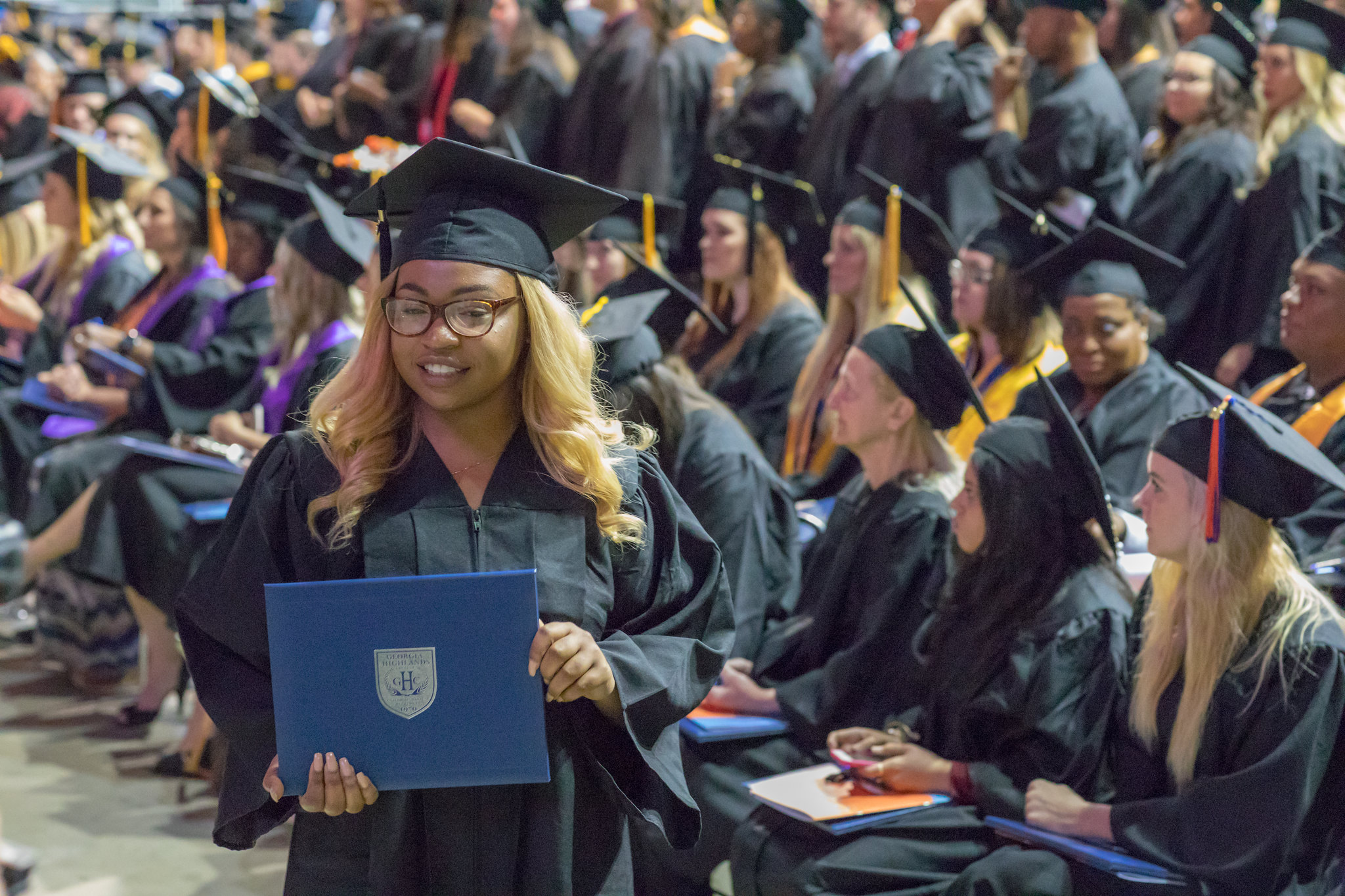 graduate holding degree