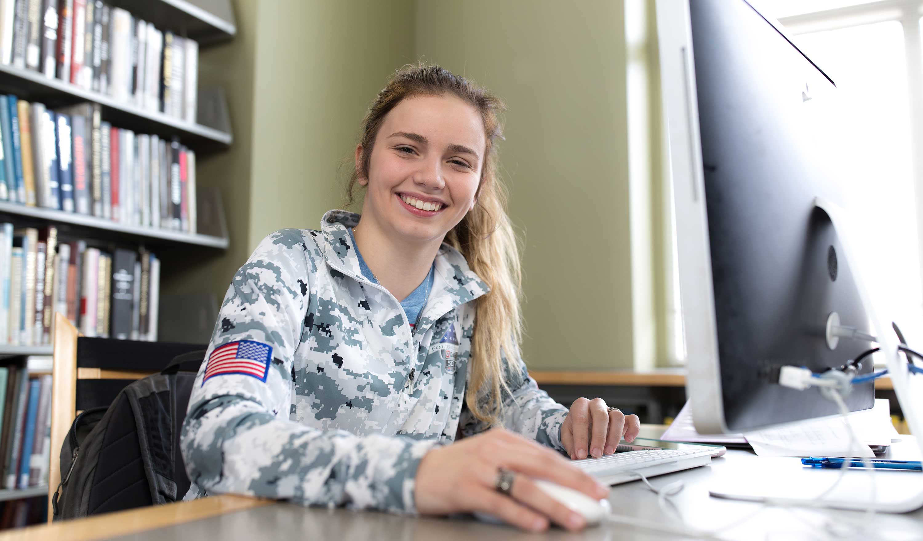 girl in library on computer