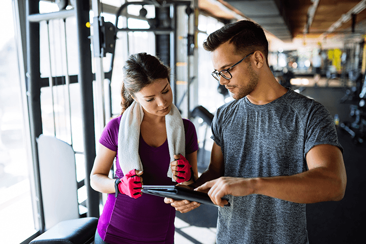 Image of two adults in a gym