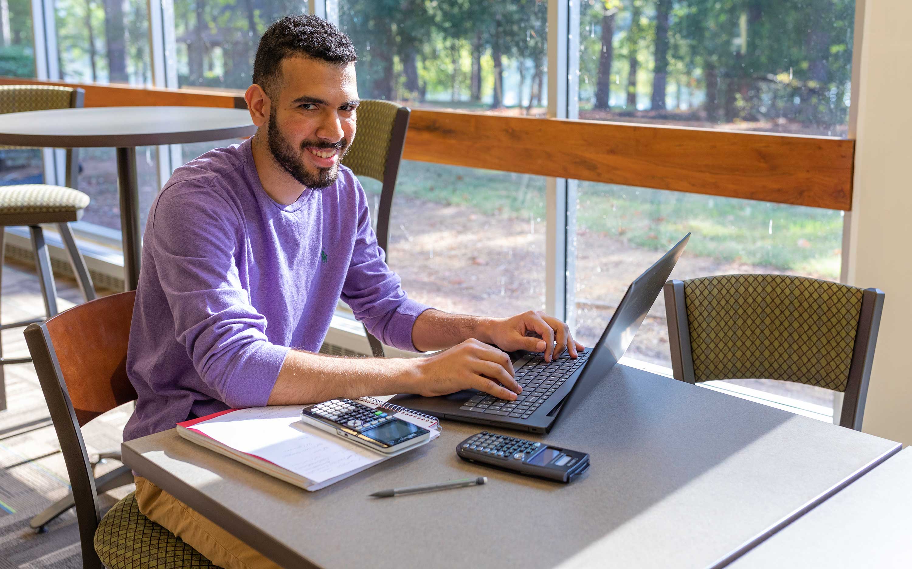 student in library