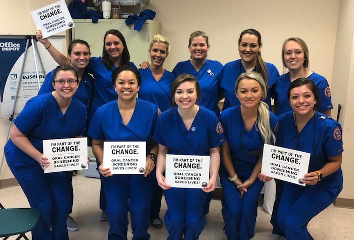 dental students holding signs