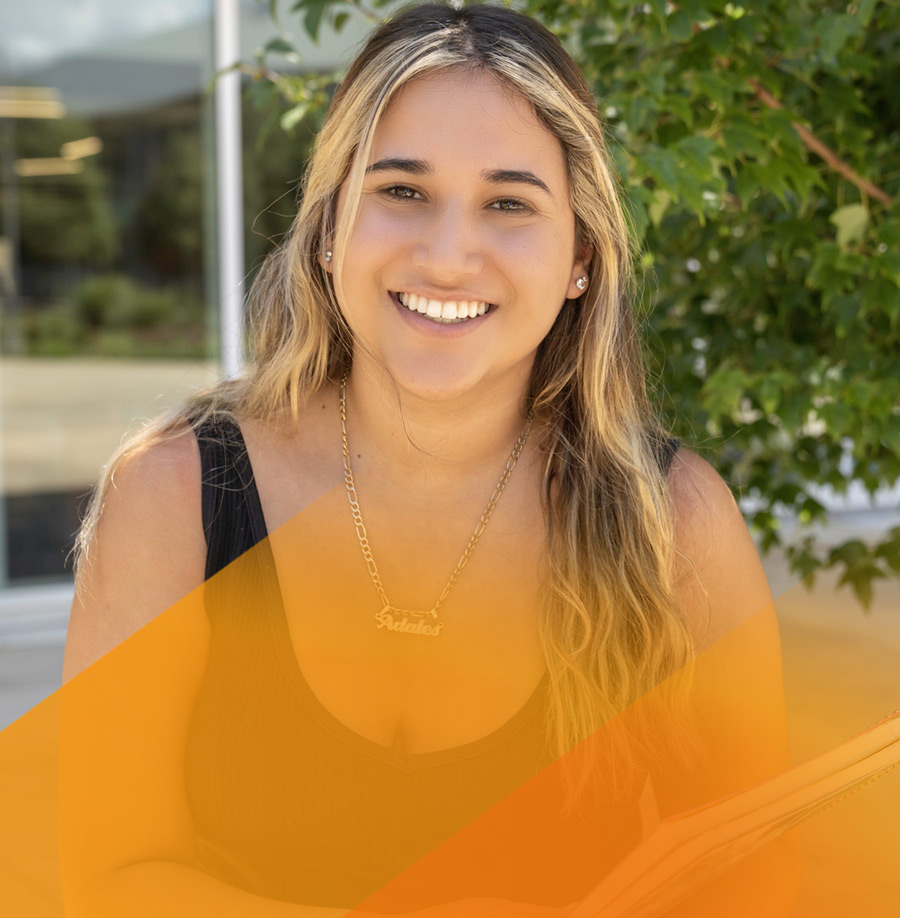 Smiling female student with notebook